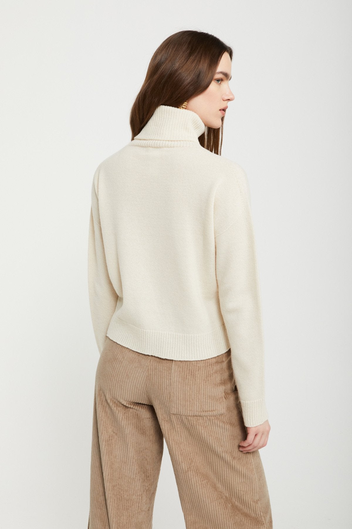 
                  
                    Knitted Turtleneck - Naturale
                  
                